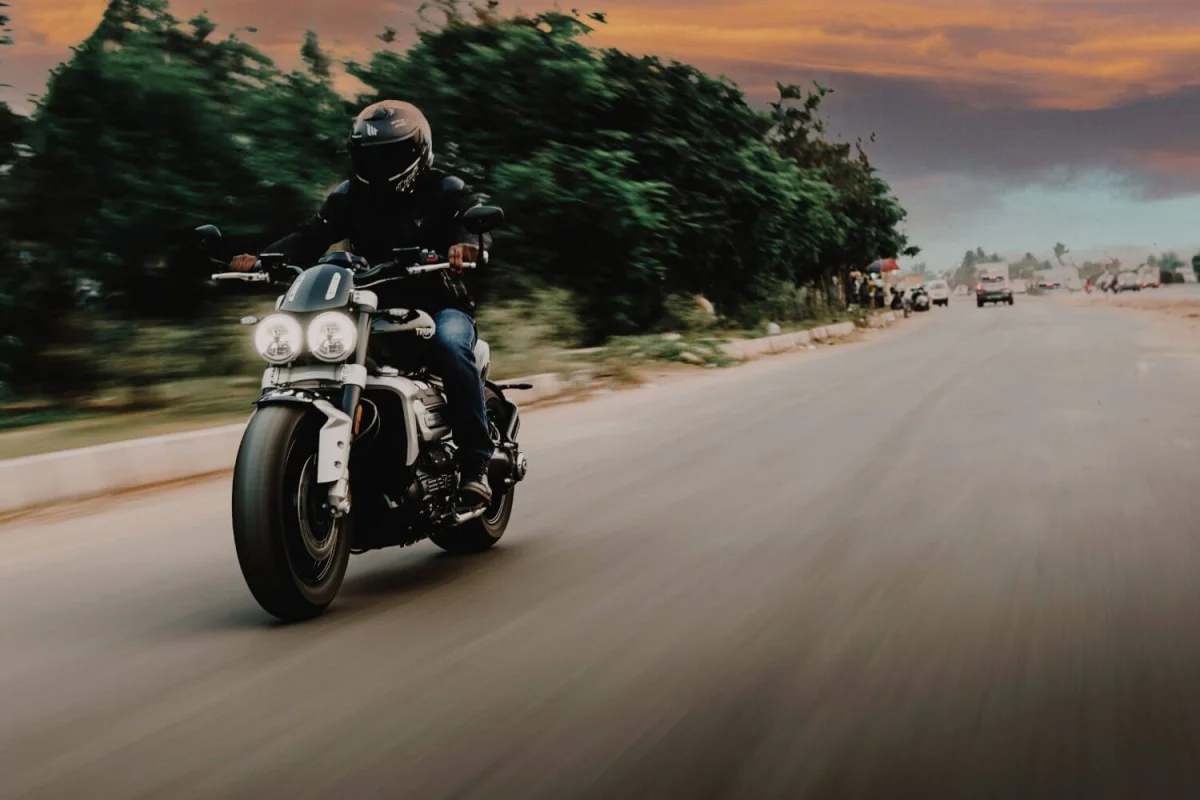 man driving motorcycle confident with motorcycle insurance coverage