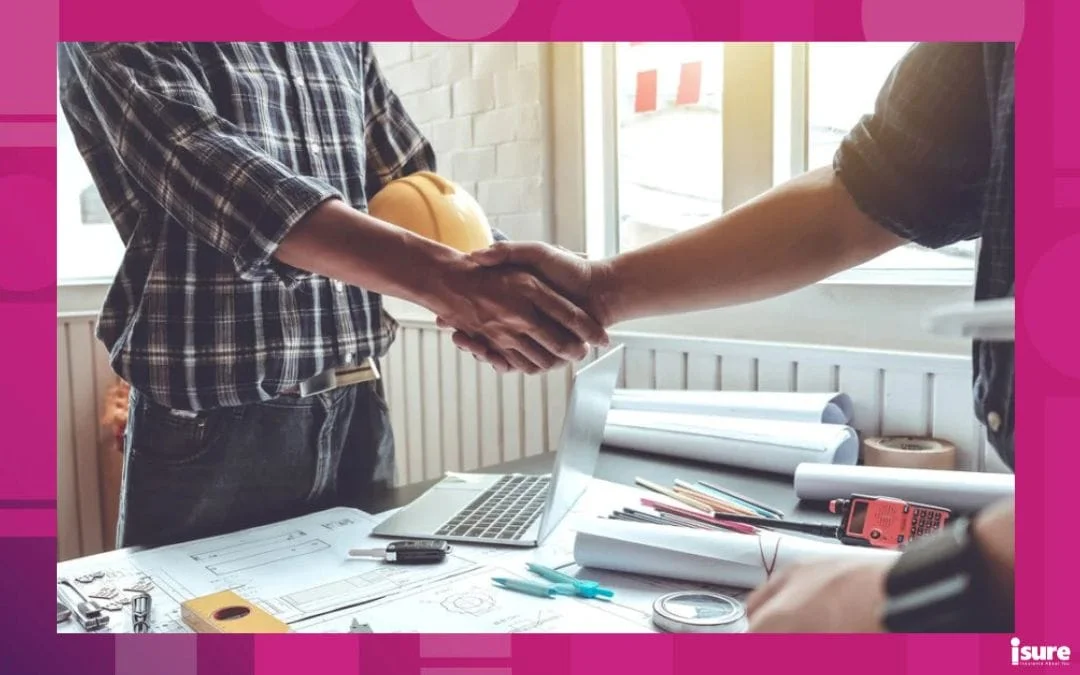 a contractor and a business partner shaking hands at a desk, protected by CGL insurance or commercial general liability insurance